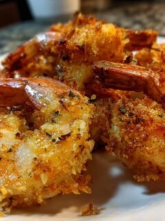 A close-up of a pile of Crispy Panko Shrimp, golden brown and perfectly seasoned, ready to be enjoyed.