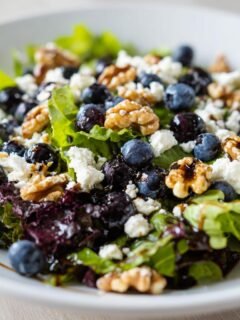 A close-up of a refreshing blueberry salad with walnuts and feta cheese, perfect for summer.
