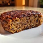 Close-up of the interior texture of an Easy Black Bean Burger patty showing mashed beans and spices.