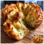 Close-up of Cheesy Christmas Tree Bread showing gooey, melted cheese pulling apart.
